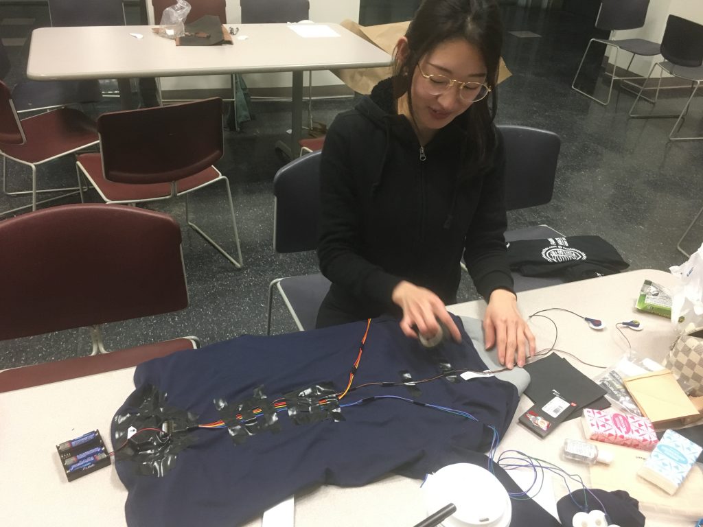 Do Yeon stitching the EMG garment